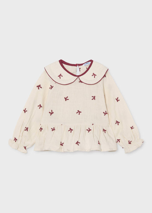 Mädchenbluse mit gestickten Schleifen